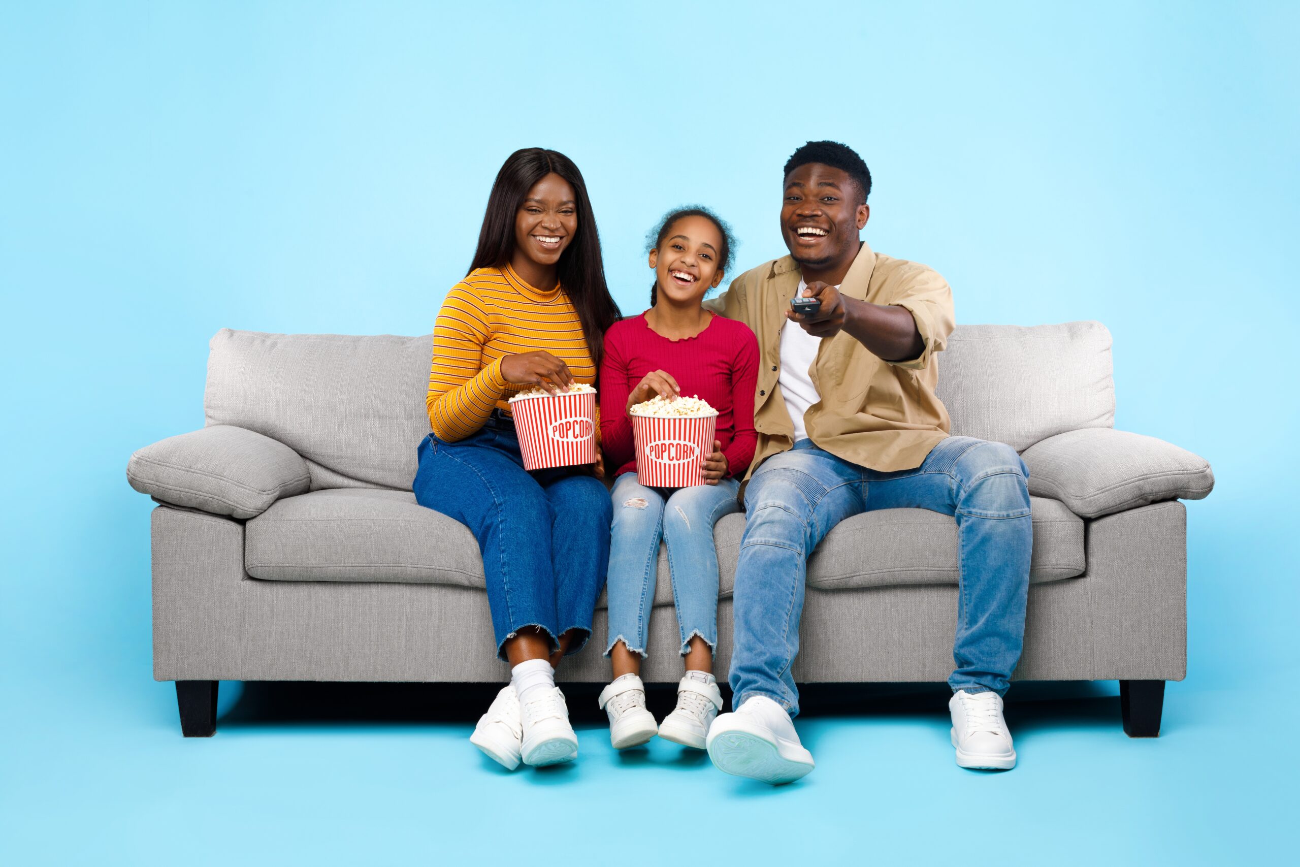 Happy,Young,Black,Family,Of,Three,People,Watching,Movie,,Parents